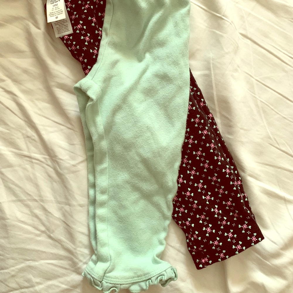Pair of Carters 18m leggings for girls.